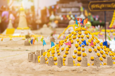 Sandcastles at temple during sunny day