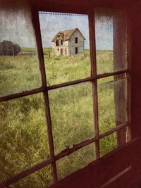 Abandoned house seen through window