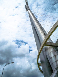 Low angle view of building against cloudy sky