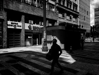Full length of woman standing in city