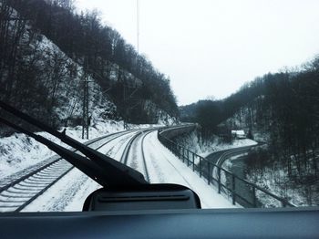 Road passing through forest