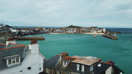 High angle view of town against cloudy sky