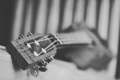 Close-up of guitar on table