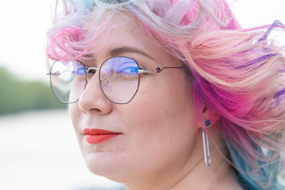 Portrait of woman wearing eyeglasses outdoors