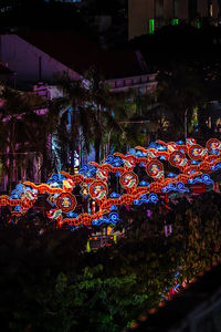 High angle view of illuminated dragon lanterns in city at night
