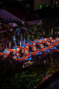 High angle view of illuminated buildings in city at night