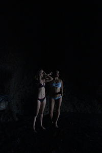 Friends on black background