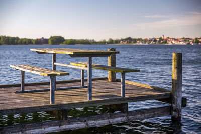 Pier on lake against sky