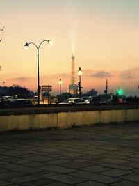 Street light in city against sky