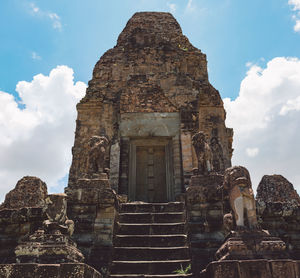 Low angle view of old temple against sky