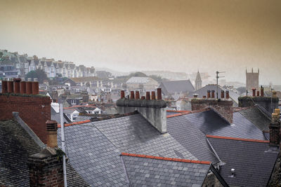 High angle view of buildings in city against sky