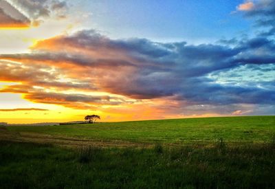 Scenic view of landscape against cloudy sky