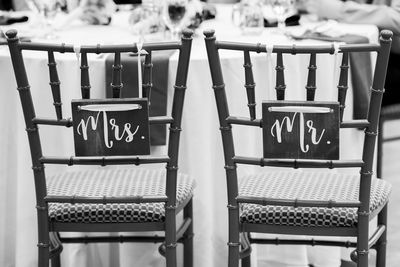 Close-up of empty chairs on table