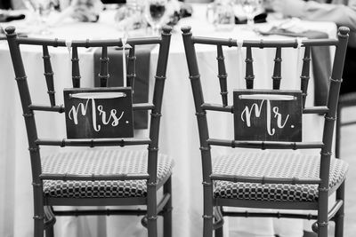 Text on empty chairs during wedding ceremony