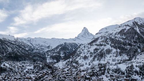 Scenic view of snowcapped mountains against sky