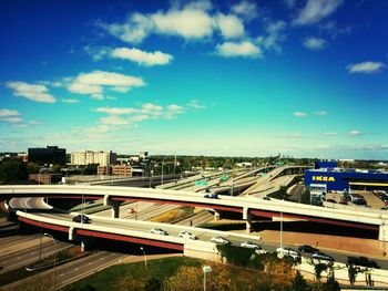 View of cityscape against blue sky