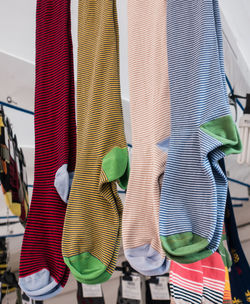 Multi colored flags hanging for sale at market stall