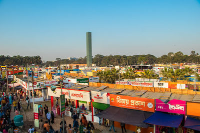 High angle view of cityscape against clear blue sky