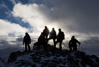 Uk, scotland, glencoe, mountaineers on top of buachaill etive beag