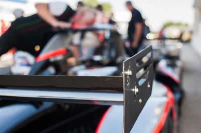 Close-up of racecar spoiler at starting line