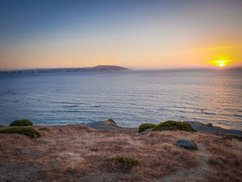 Scenic view of sea against sky during sunset