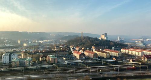 High angle view of buildings in city against sky