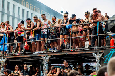 Group of people standing against built structure