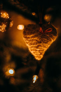 Close-up of illuminated lighting equipment at night