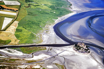 High angle view of sea seen through land