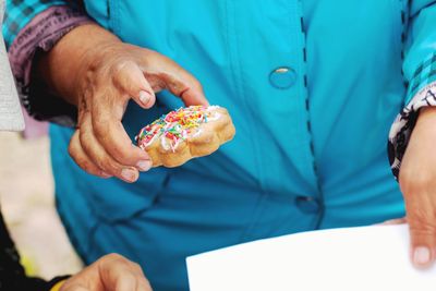 Midsection of woman holding ice cream