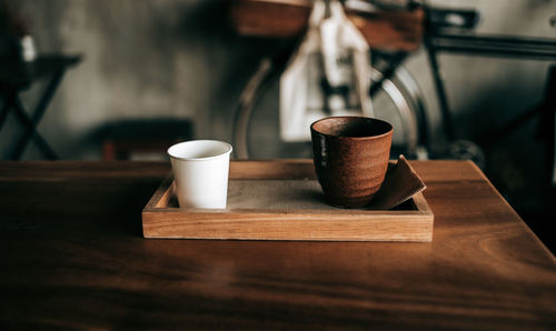 Close-up of coffee served on table at cafe