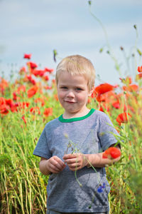 Full length of a boy standing on field