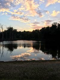 Scenic view of lake against sky during sunset