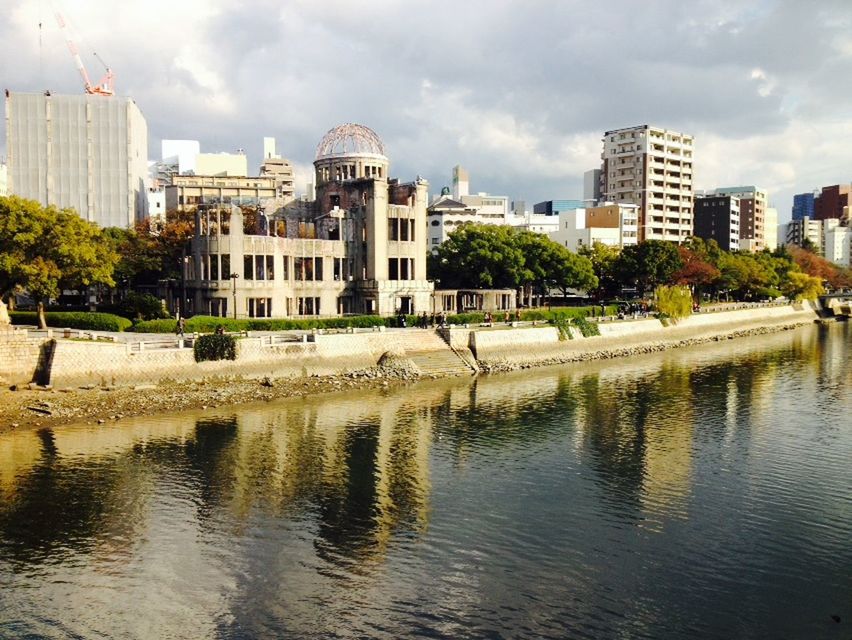 building exterior, architecture, built structure, water, sky, city, waterfront, cloud - sky, reflection, river, building, tree, cloudy, residential building, cloud, modern, cityscape, skyscraper, residential structure, city life