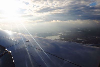 Aerial view of road seen through airplane window