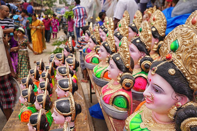 Close-up of statues for sale in market