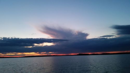 Scenic view of sea against sky at sunset