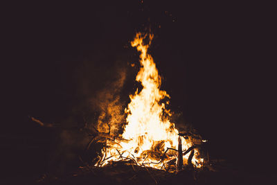 Campfire on field at night