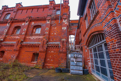 Low angle view of old building against sky