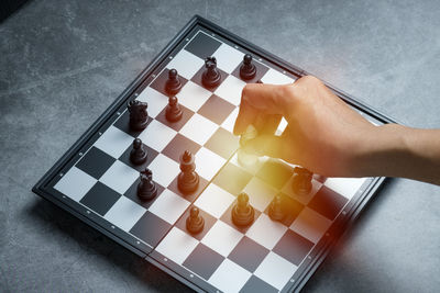 High angle view of person on chess board