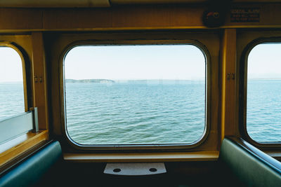 View of sea seen through window