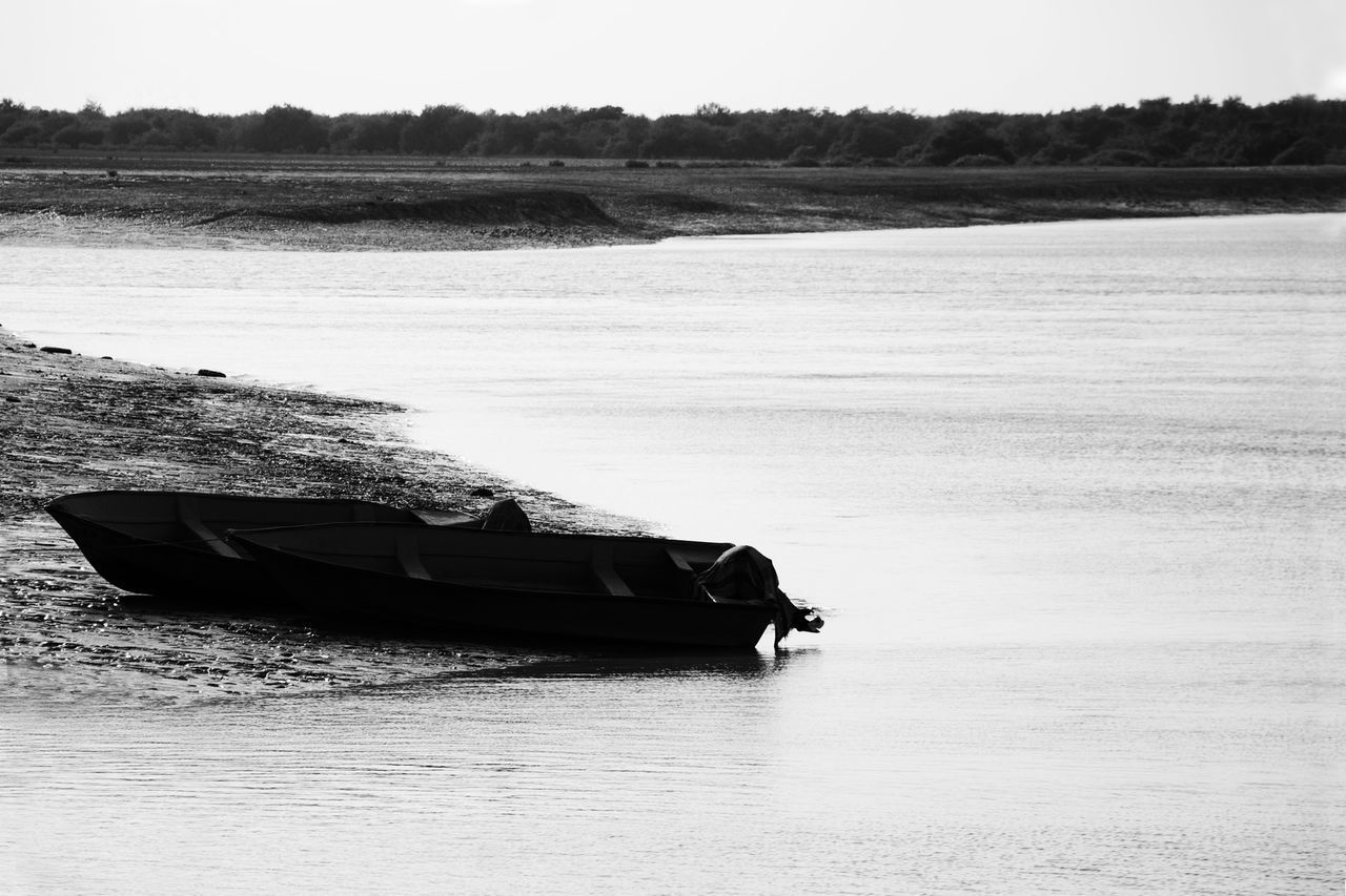 transportation, water, nautical vessel, boat, lake, river, tranquil scene, rippled, mode of transport, tranquility, riverbank, scenics, nature, waterfront, non-urban scene, outdoors, beauty in nature, water surface, vacations