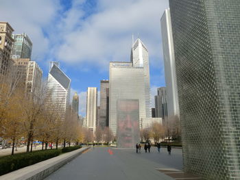 Skyscrapers in city against sky