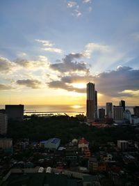 High angle view of buildings against sky during sunset