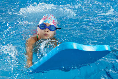 Portrait of woman swimming in sea