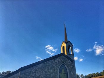 Low angle view of church against blue sky