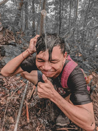 Portrait of a young man in forest