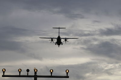 Low angle view of airplane flying in sky