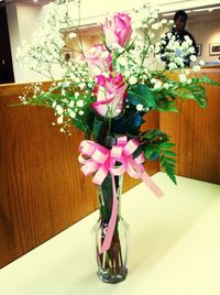 Flower vase on table at home