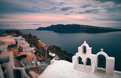 Church by sea during sunset at santorini